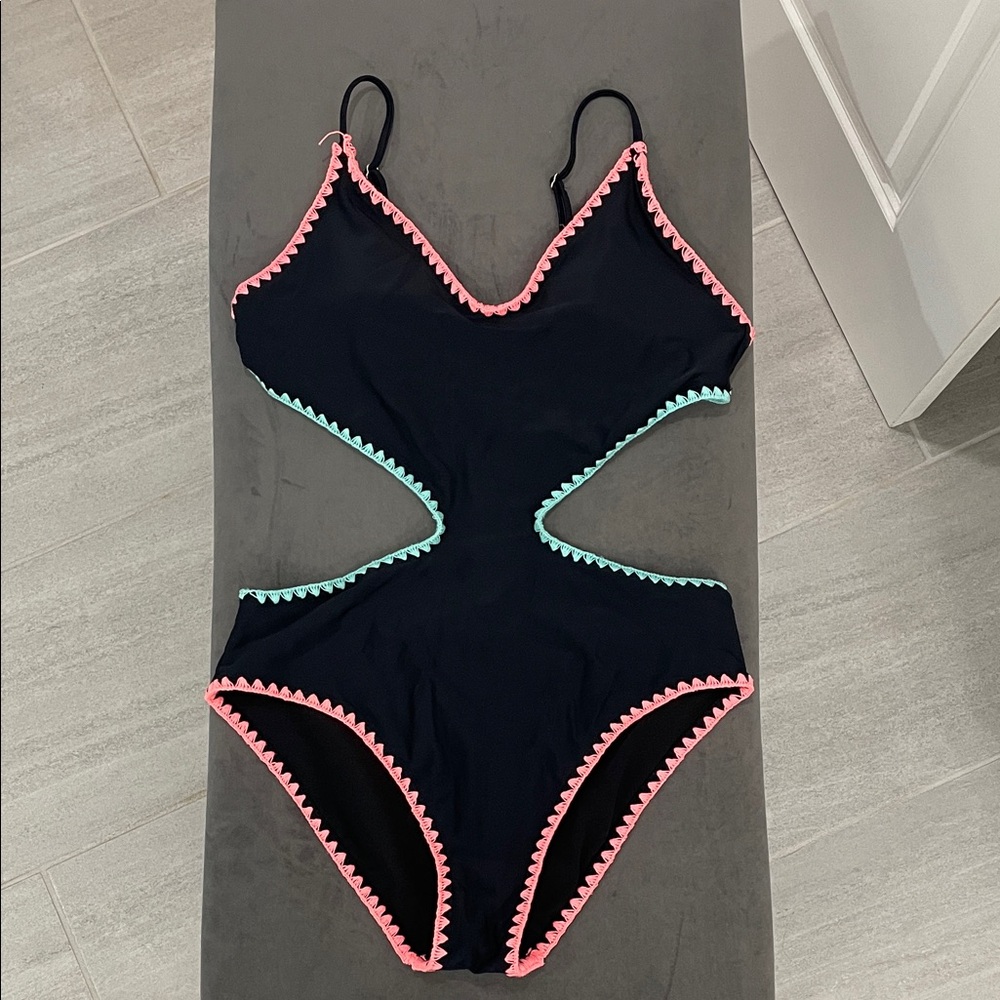 Black cut out swimsuit with crochet accents